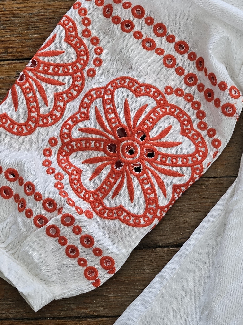 White Embroidered V-Neck Peasant Top with Reddish/Orange Accents